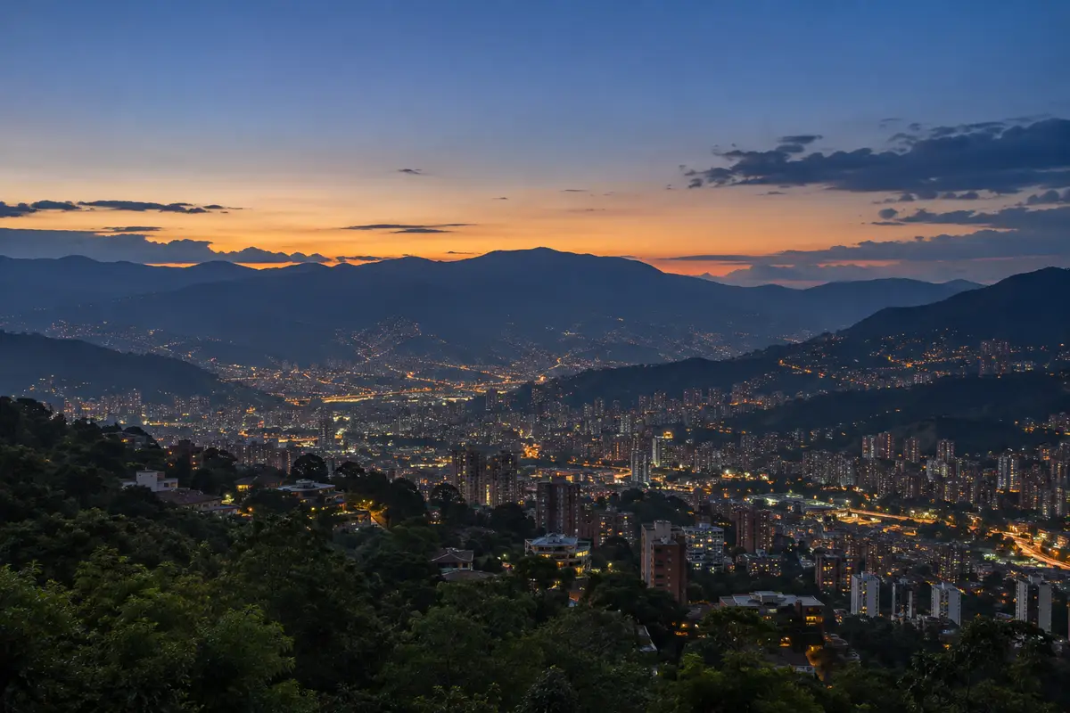 Illustration of Medellín's valley lights at dusk beneath the mountains